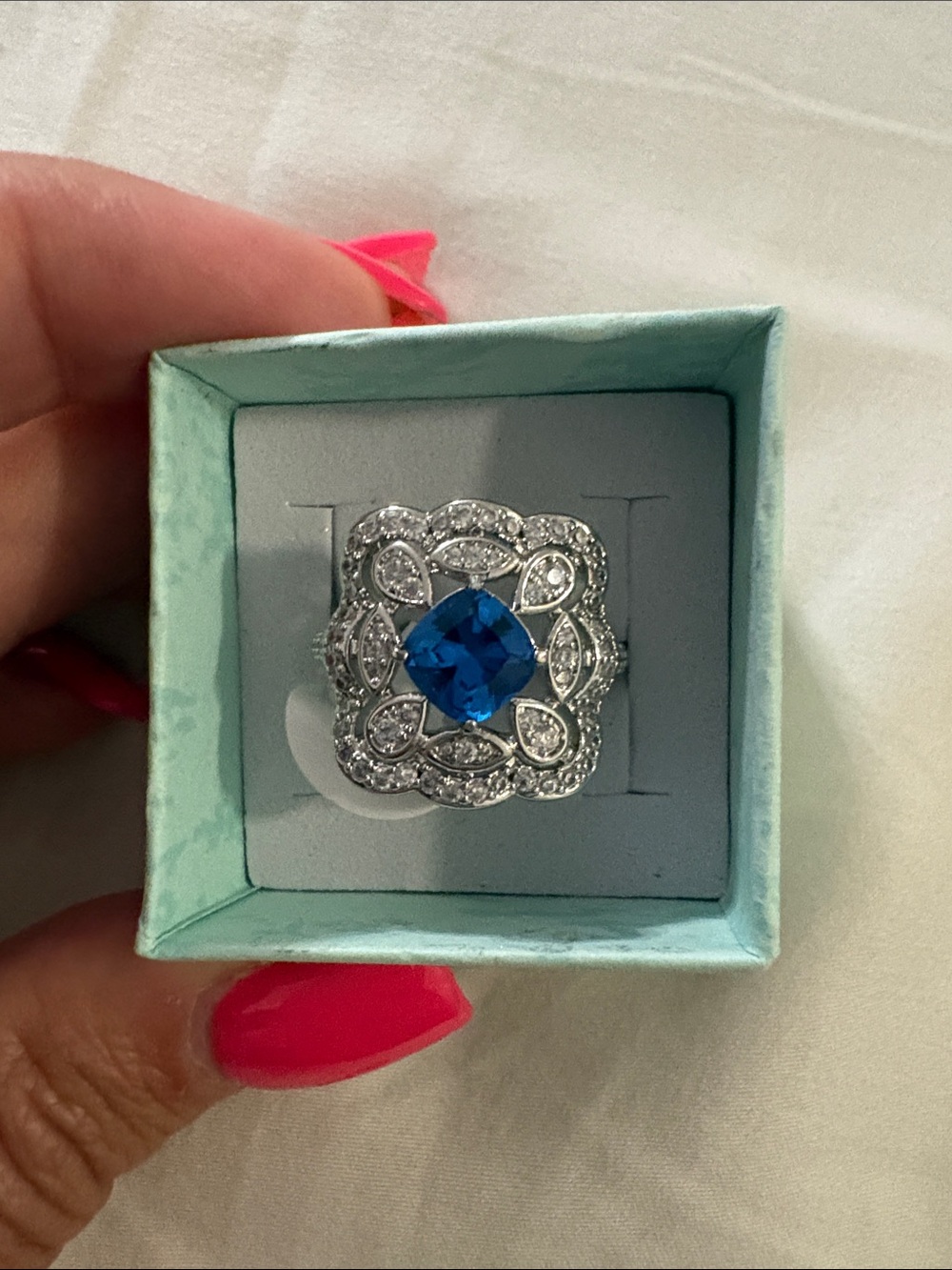 Blue Center Stone Silver Floral Halo Ring